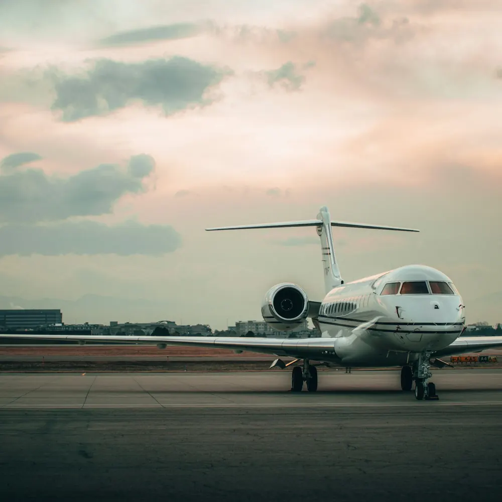 Super-midsize jet on a ramp at dusk